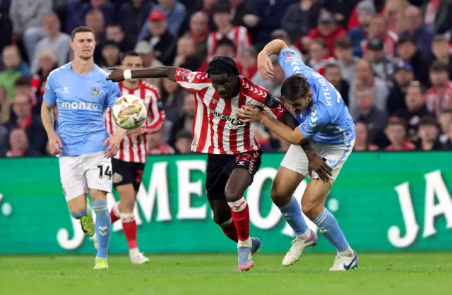 Sunderland's Eliezer Mayenda and Coventry City's Liam Kitching