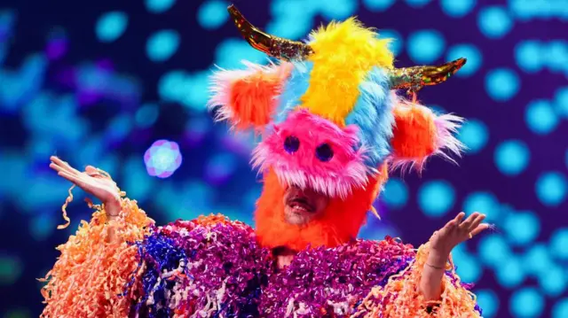 A performer gestures onstage during the dress rehearsal 2 of the first semi-final of the 2025 Eurovision Song Contest