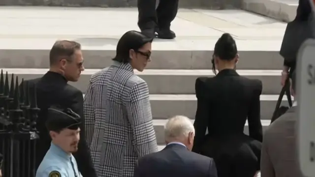 Kim K walking upstairs. Photo taken from behind