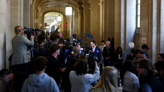 Members of media wait at Kim Kardashian's robbery trial