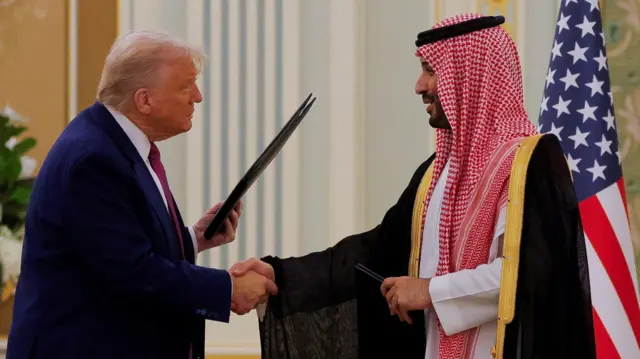 Donald Trump and Mohammad bin Salman shake hands