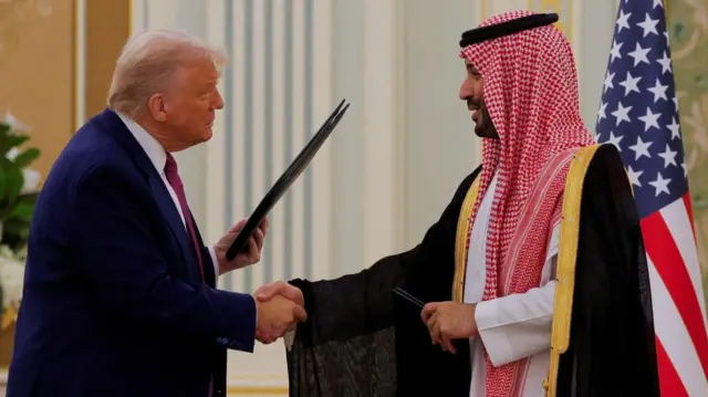 US President Donald Trump and Saudi Crown Prince and Prime Minister Mohammed Bin Salman shake hands during a Memorandum of Understanding (MOU) signing ceremony at the Royal Court in Riyadh,