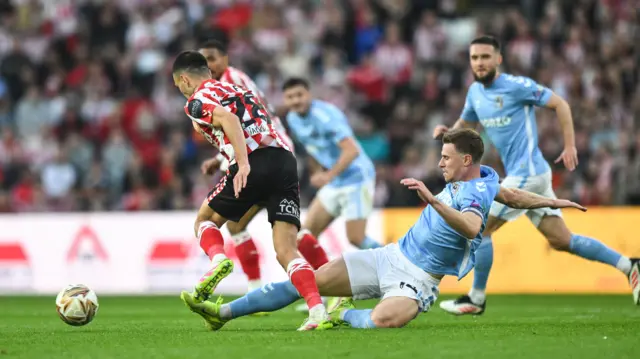 Ben Sheaf of Coventry City brings down Enzo Le Fee of Sunderland