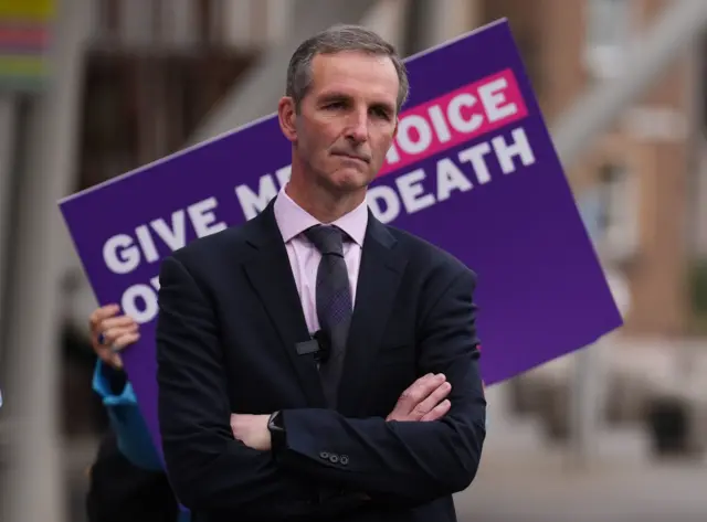Liberal Democrat MSP Liam McArthur speaks to supporters of a change in the law on assisted dying outside the Scottish Parliament at a demo attended by members of Dignity in Dying Scotland and members of the Assisted Dying Coalition as they show their support for a change in the law on assisted dying outside the Scottish Parliament in Edinburgh, ahead of the debate and vote on the Assisted Dying for Terminally Ill Adults (Scotland) Bill later today.
