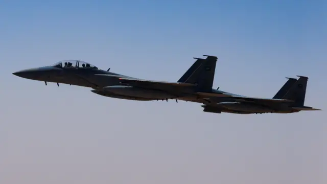 A Saudi fighter jet accompanies Air Force One