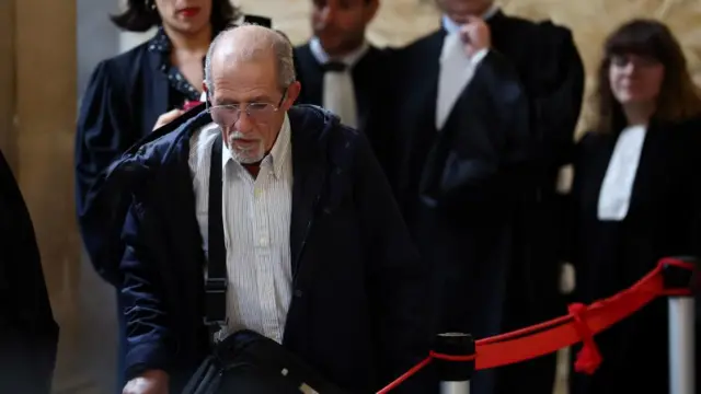 Aomar Ait Khedache leaves during a break on the first day of his trial