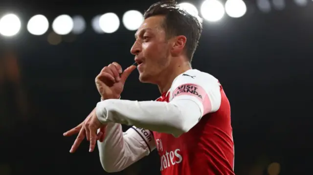 Mesut Ozil of Arsenal celebrates