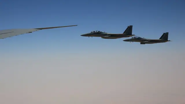 F-15SA fighter jets from the Royal Saudi Air Force escort Air Force One ferrying U.S. President Donald Trump as they prepare to land at King Khalid International Airport on May 13, 2025, in Riyadh, Saudi Arabia. T