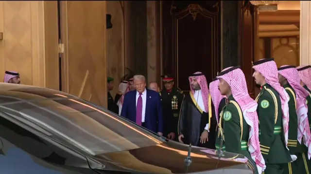 Donald Trump being escorted from the court and into a black car