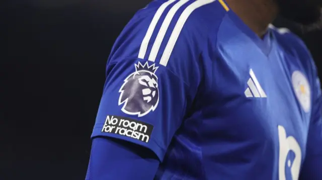 Detailed view of the Premier League badge and No room for Racism patch on the sleeve of a Leicester City player