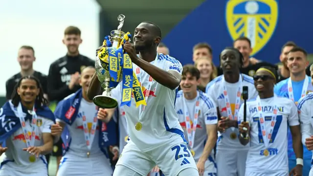 Josuha Guilavogui of Leeds United celebrates with the Championship trophy
