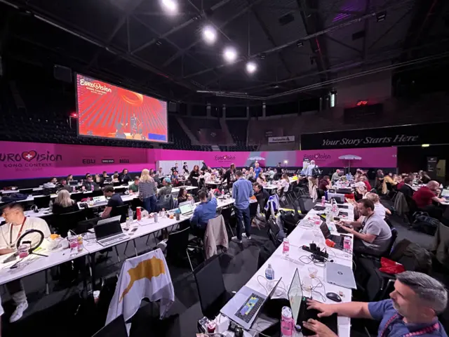 Journalists and fans at the Eurovision media centre in Basel, Switzerland