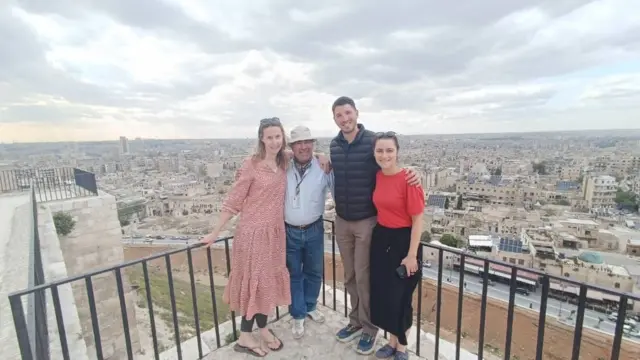 Abdulhai pictured with his family on a balcony overlooking a city