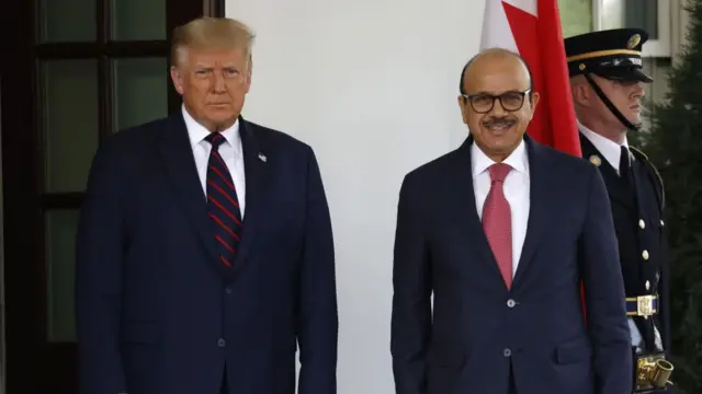 Trump standing next to the Bahrain foreign minister