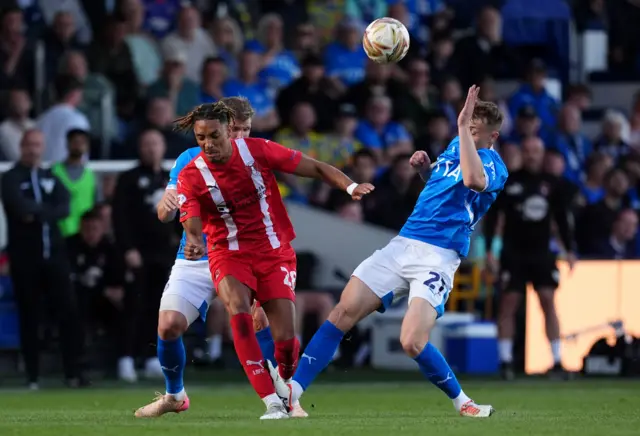 Stockport County's Owen Moxon (right) fouls Leyton Orient's Sean Clare