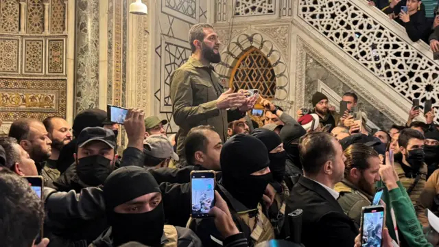 Al-Sharaa peaking to supporters inside the Ummayad Mosque in Damascus in December, after the fall of the Assad regime