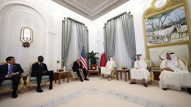 Trump and the Emir sit in a ceremonial room at the Amiri Diwan in Doha, Qatar