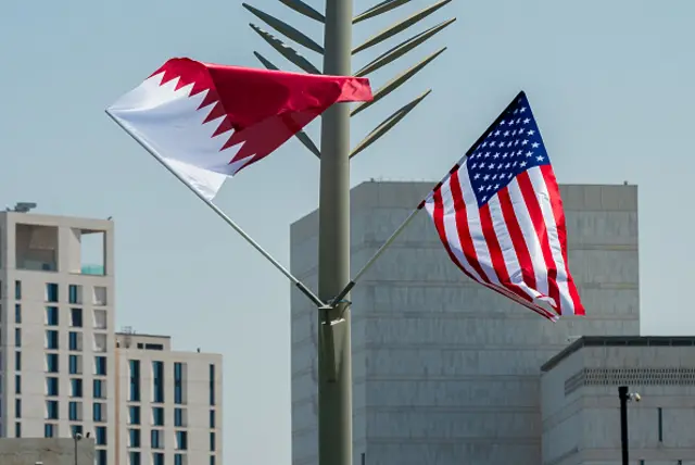 US and Qatar flags flutter on the Doha corniche ahead of the arrival of U.S. President Donald Trump in Doha,