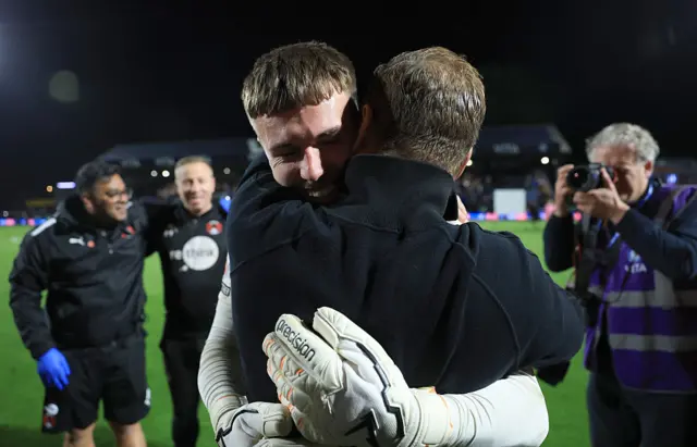 Josh Keeley of Leyton Orient hugs Richie Wellens, Manager of Leyton Orient,
