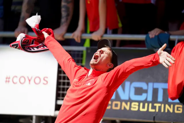 A Leyton Orient fan celebrates