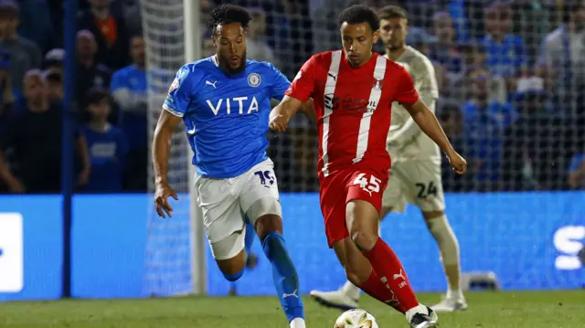 Rarmani Edmonds-Green of Leyton Orient feels pressure from Kyle Wootton of Stockport County