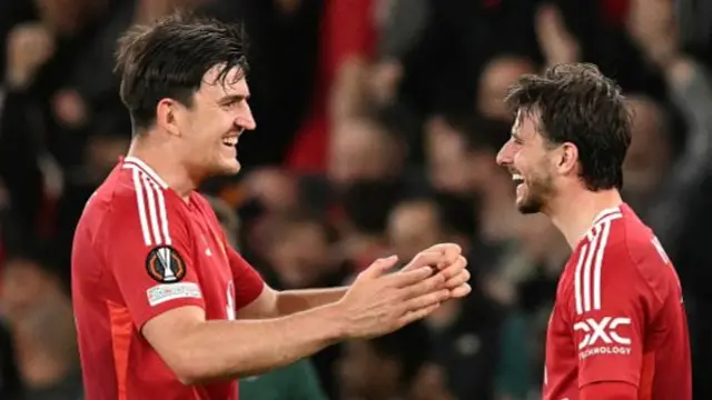 Harry Maguire celebrates with Manchester United team-mate Mason Mount