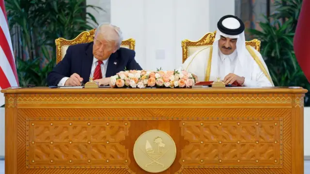 U.S. President Donald Trump and Qatar's Emir Tamim bin Hamad Al Thani attend a signing ceremony in Doha, Qatar