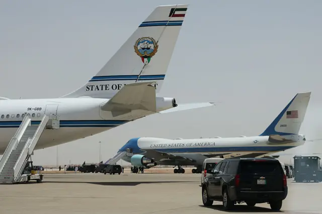 Air Force One stands next to a State of Kuwait Airbus plane on the tarmac as Donald Trump prepares to depart King Khalid International Airport in Riyadh