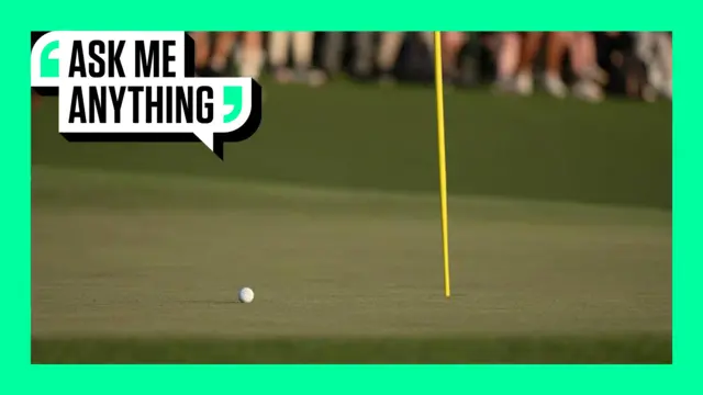 A ball on the green at Augusta with a Ask Me Anything banner