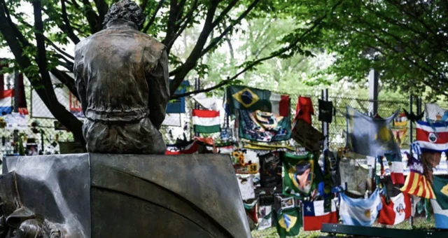 Flags and banners left at the Ayrton Senna Memorial in Imola