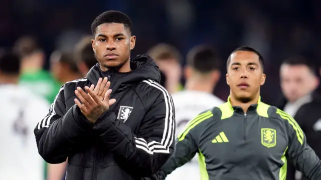 Marcus Rashford applauds the Aston Villa fans beside team-mate Youri Tielemans