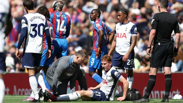 Dejan Kulusevski receives treatment in Sunday's defeat at home to Crystal Palace