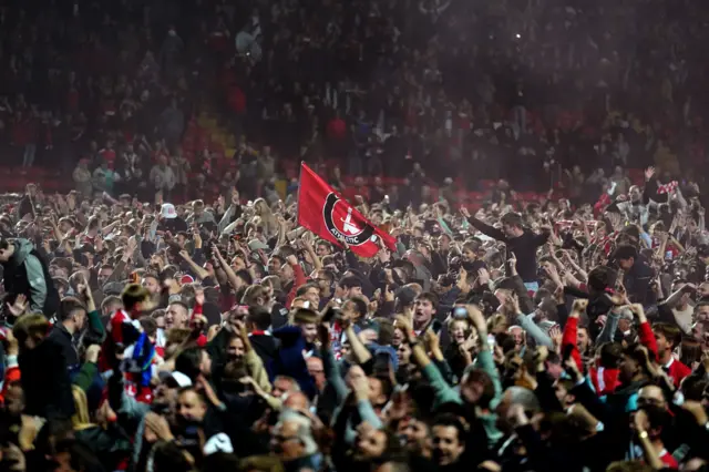 Charlton fans on the pitch