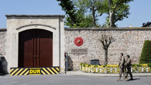 Military personnel walk outside the Turkish Presidency's Dolmabahce working office, where Russia and Ukraine direct talks might happe
