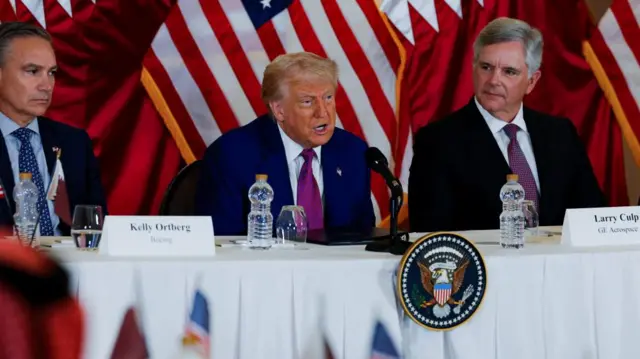Donald Trump speaking into microphone.
