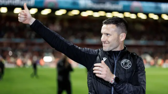 Walsall boss Mat Sadler celebrates