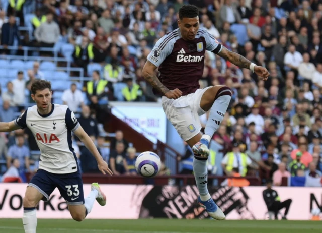 Aston Villa's Morgan Rogers shoots at goal