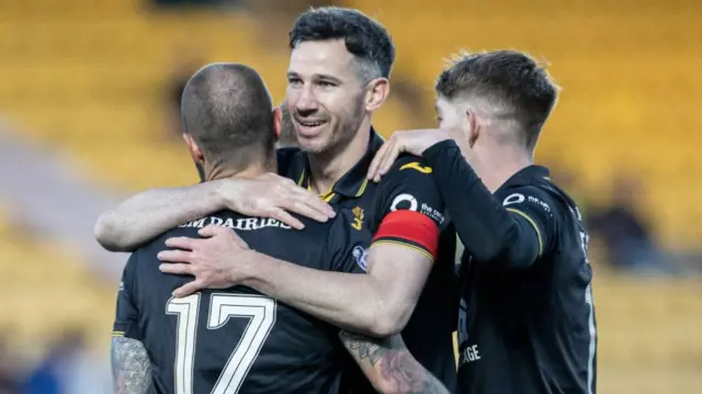 Livingston's Ryan McGowan celebrates with Stevie May