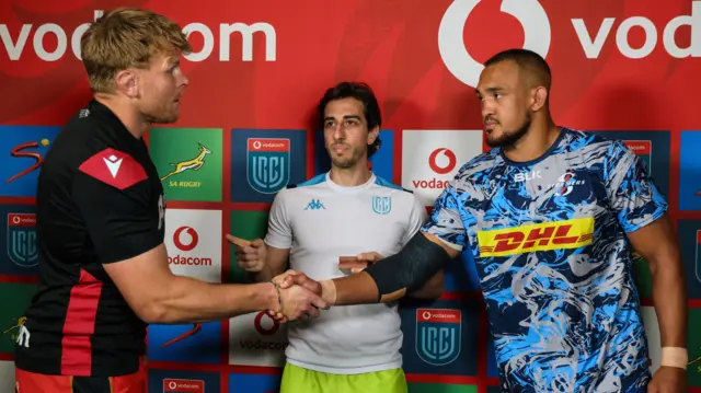 Cardiff's Josh McNally, referee Gianluca Gnecchi and DHL Stormers' Salmaan Moerat at the toss
