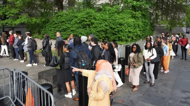 People wait in line to enter Federal court for the Sean "Diddy" Combs' sex traf