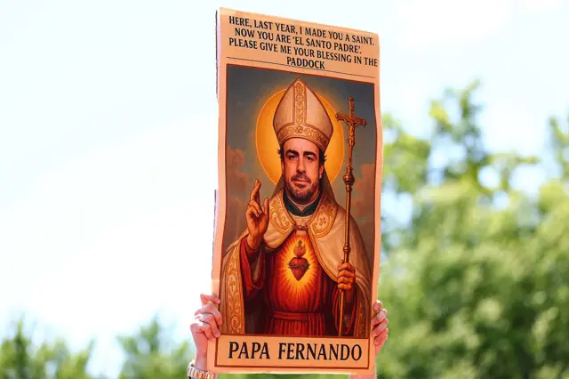 A homemade sign of Fernando Alonso as a Saint