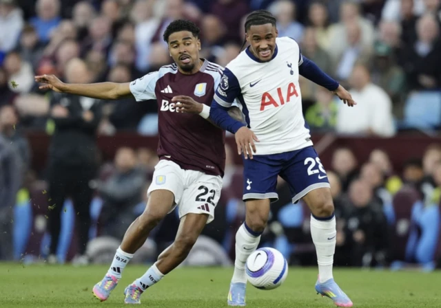 Aston Villa's Ian Maatsen (left) and Tottenham Hotspur's Wilson Odobert battle for the ball