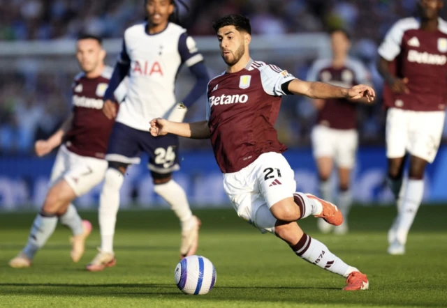 Aston Villa's Marco Asensio (centre) in action