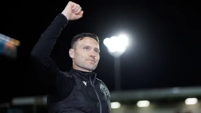 Walsall boss Mat Sadler punching the air
