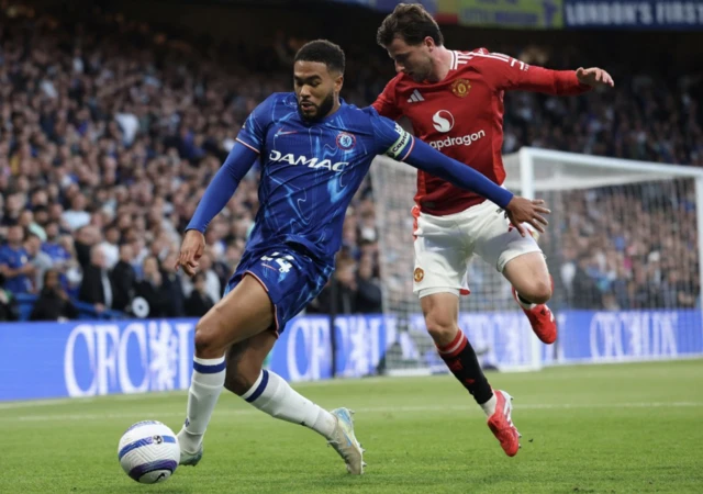 Chelsea's Reece James in action with Manchester United's Mason Mount