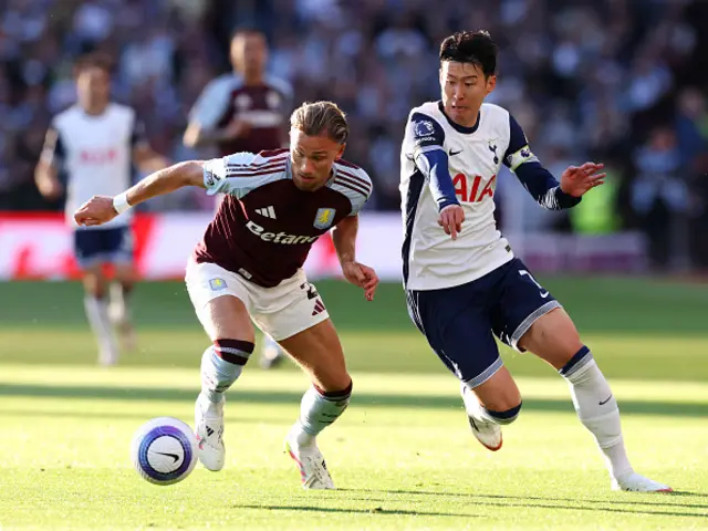 Matty Cash of Aston Villa is challenged by Son Heung-Min