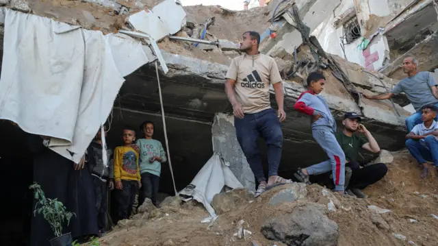 Residents inspect rubble in Jabalia