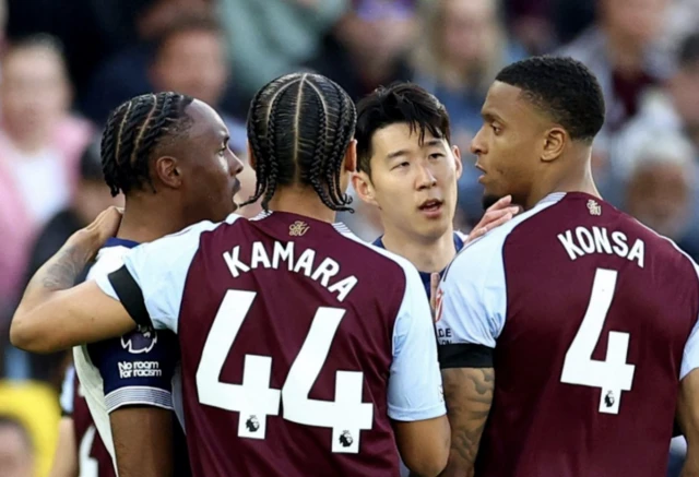 Aston Villa's Ezri Konsa clashes with Tottenham Hotspur's Mathys Tel as Aston Villa's Boubacar Kamara and Tottenham Hotspur's Son Heung-min intervene
