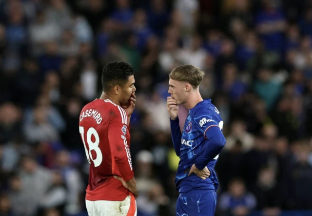 Manchester United's Casemiro and Chelsea's Cole Palmer speak