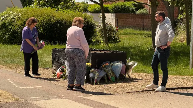 People laying flowers